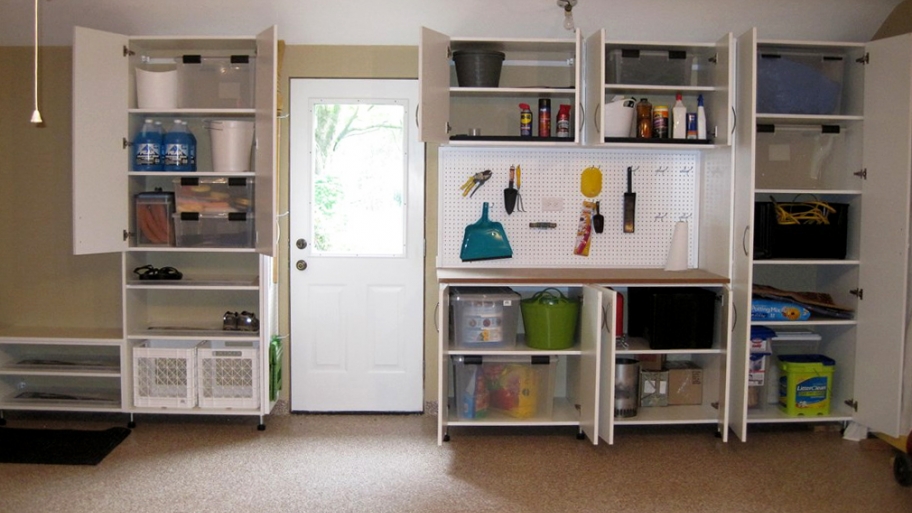 A garage with cabinets and wall storage